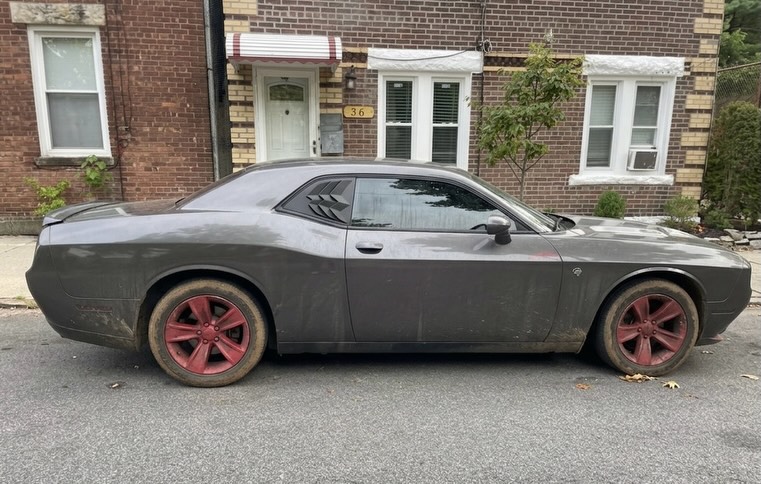 Dodge Challenger covered in dust and grime before exterior detail