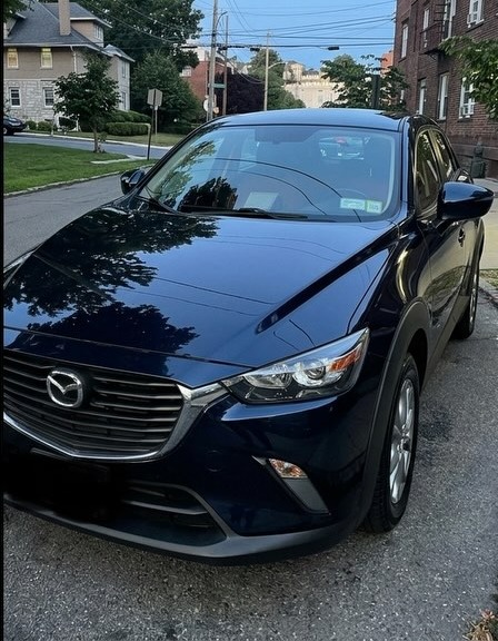Same Mazda CX-3 after exterior detail, paint transformed to a glossy scratch-free shine